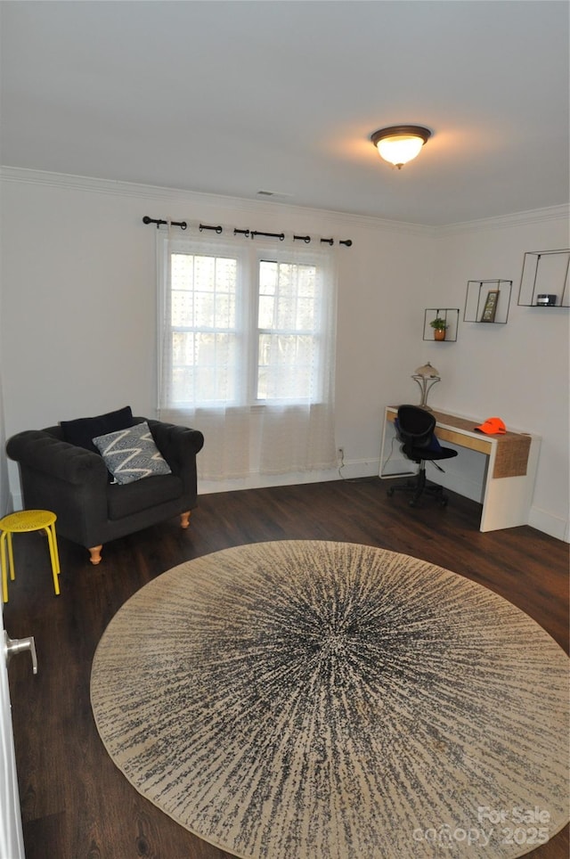 sitting room featuring dark hardwood / wood-style floors and crown molding