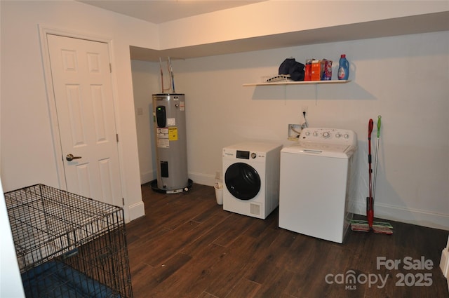 laundry room with washer and clothes dryer, dark hardwood / wood-style floors, and water heater