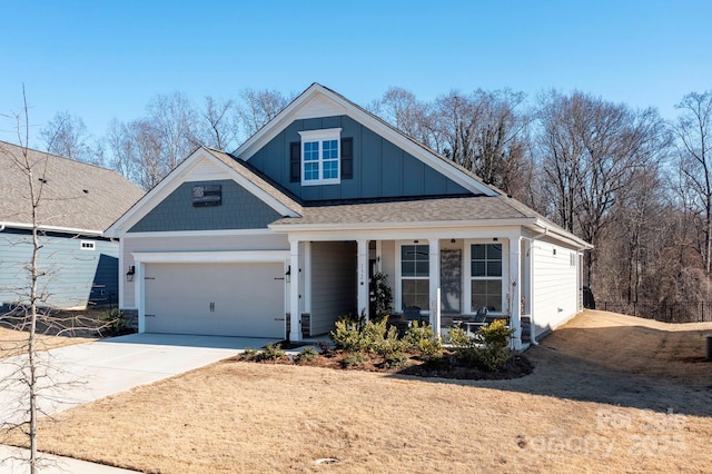 view of front of house featuring a porch and a garage