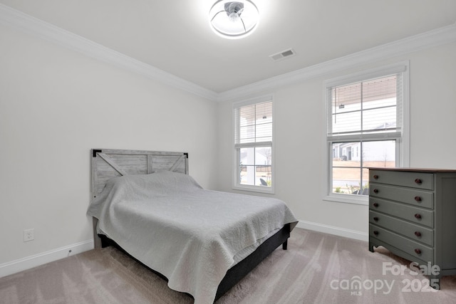 carpeted bedroom featuring ornamental molding