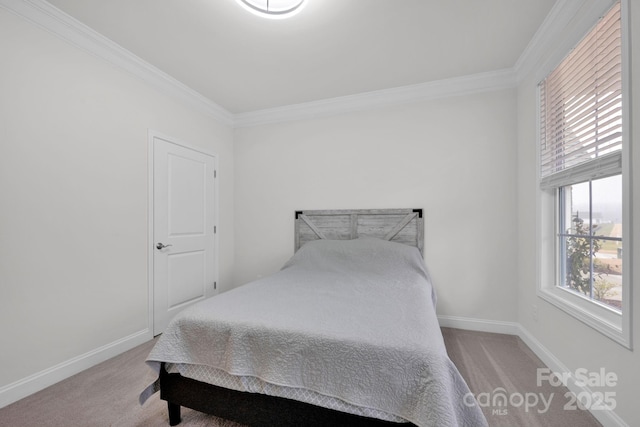 carpeted bedroom featuring ornamental molding