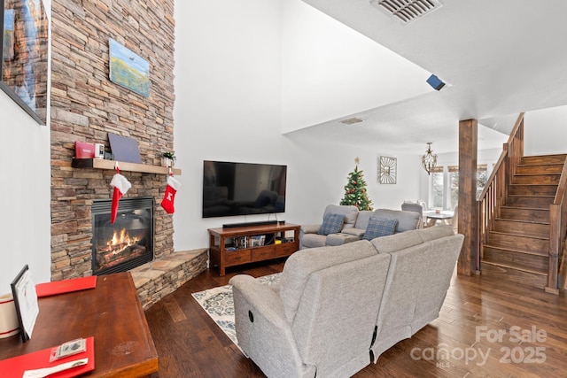 living room featuring a fireplace and dark hardwood / wood-style flooring