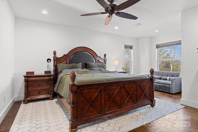 bedroom with hardwood / wood-style floors and ceiling fan