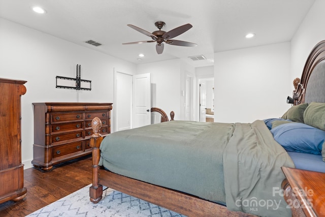 bedroom with dark hardwood / wood-style floors and ceiling fan