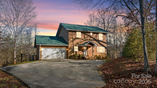 view of front of property with a garage