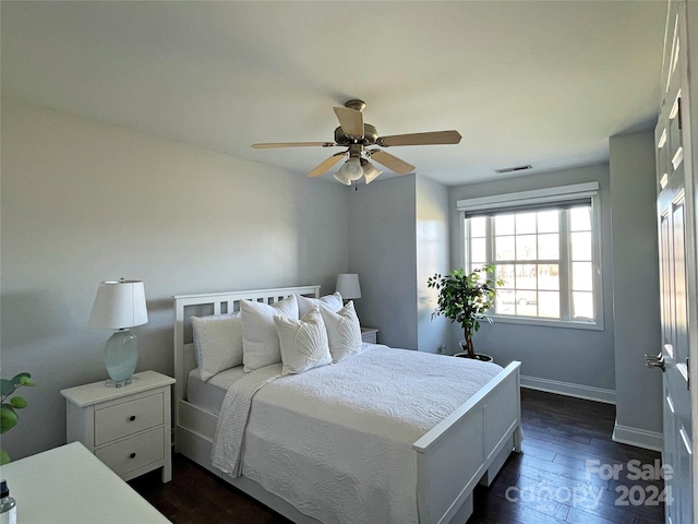 bedroom featuring ceiling fan and dark wood-type flooring