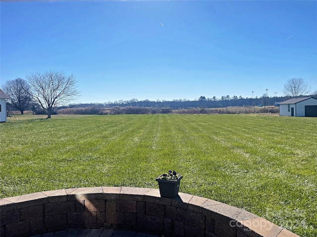 view of yard with a rural view