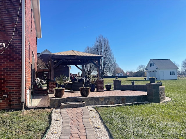 view of yard featuring a gazebo and an outdoor structure