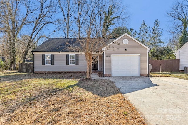 ranch-style house featuring a garage and a front lawn