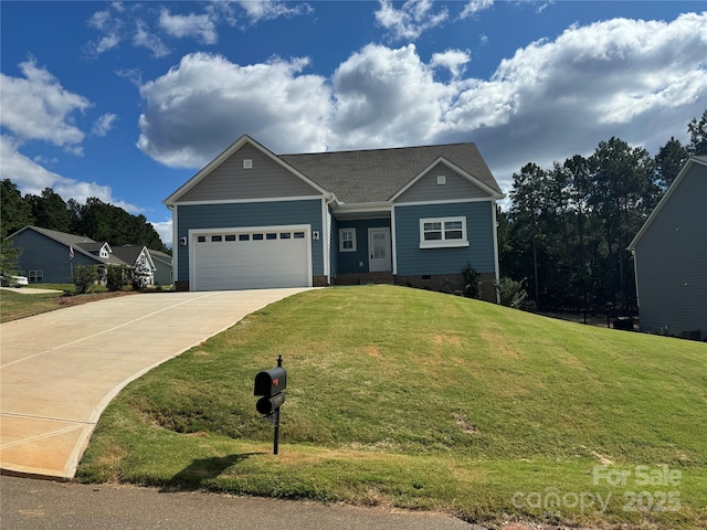 view of front of home featuring a front yard and a garage