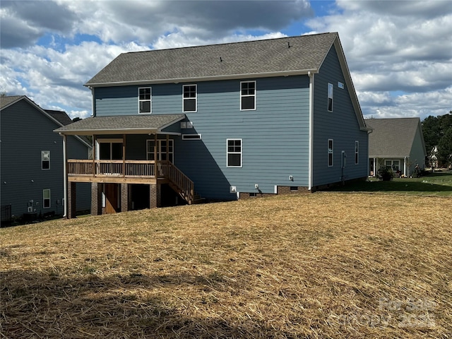 back of house featuring a yard