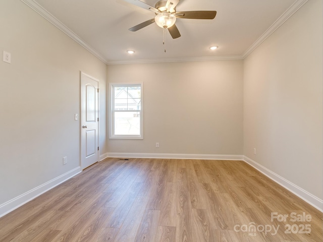 unfurnished room featuring ceiling fan, light hardwood / wood-style floors, and ornamental molding