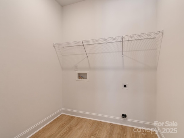 washroom featuring washer hookup, electric dryer hookup, and wood-type flooring