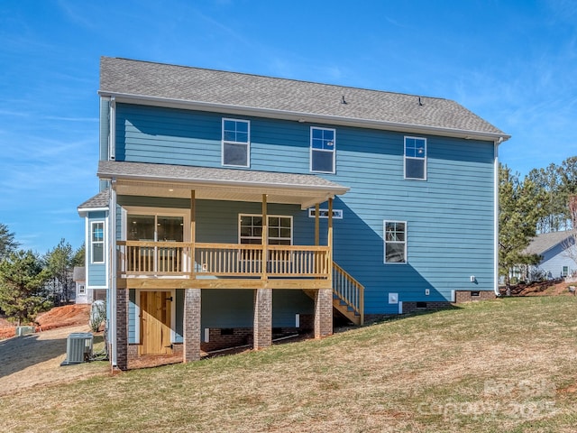 back of house featuring crawl space, a yard, and central AC