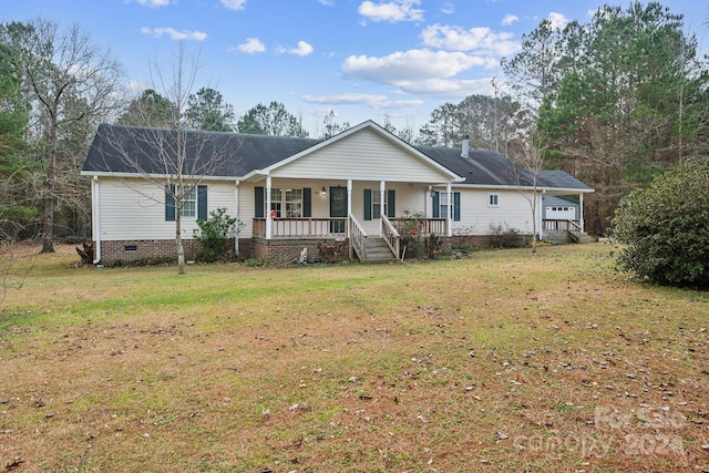 ranch-style home with a front yard and a porch