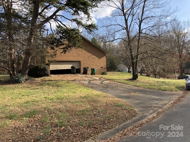 view of side of property with a yard