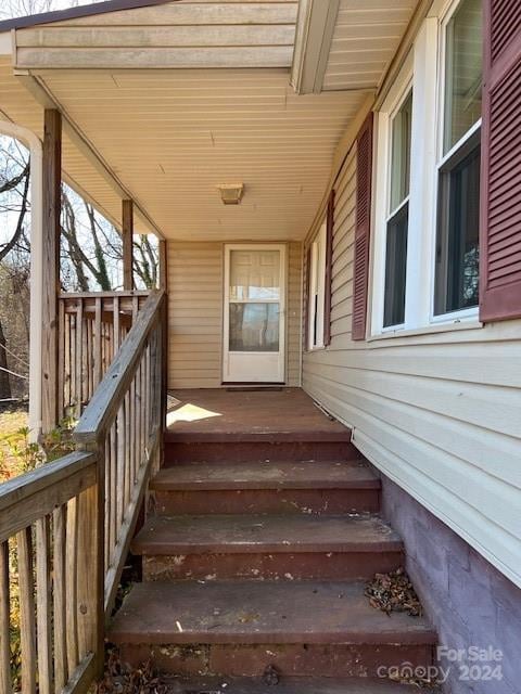 property entrance with covered porch