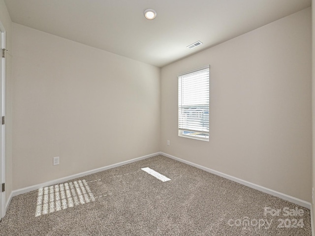 view of carpeted spare room