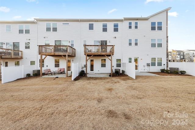 rear view of house featuring a patio area and central AC