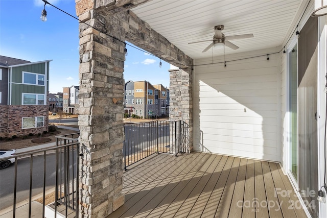 wooden terrace featuring ceiling fan