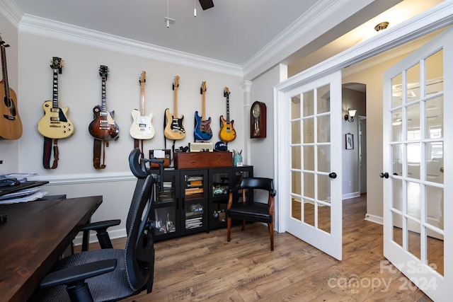 office space featuring wood-type flooring, ornamental molding, and french doors