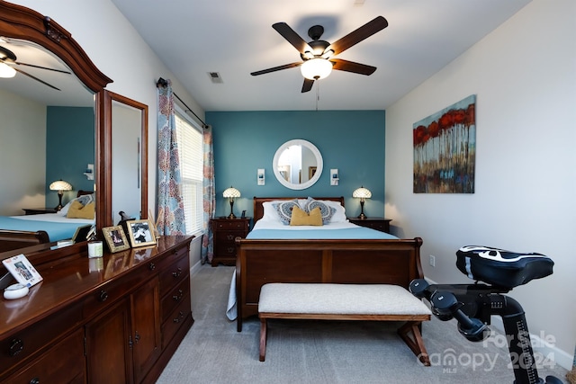 bedroom featuring ceiling fan and light carpet