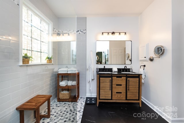 bathroom with plenty of natural light and vanity