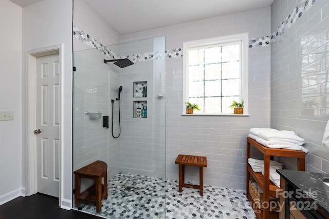 bathroom with a tile shower