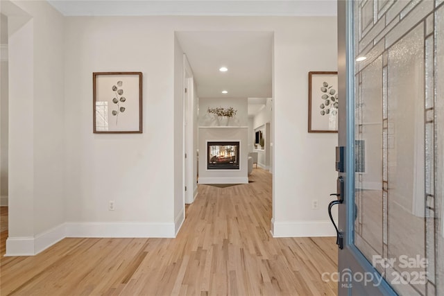 hall with light wood-type flooring