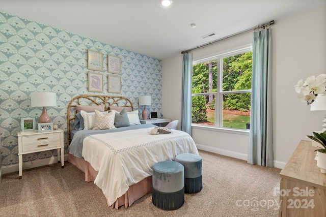 bedroom with light colored carpet