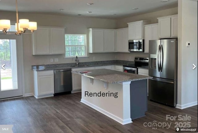 kitchen featuring stainless steel appliances, decorative light fixtures, a notable chandelier, a center island, and white cabinetry