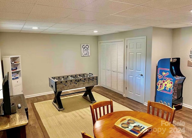 recreation room with dark wood-type flooring