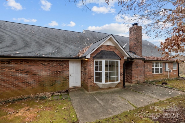 back of property with a patio area