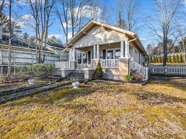 bungalow featuring a porch and a front yard