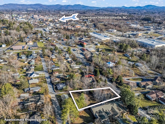 drone / aerial view featuring a mountain view