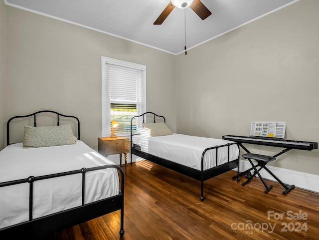 bedroom featuring ceiling fan and hardwood / wood-style flooring