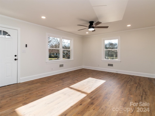 foyer entrance featuring ceiling fan, crown molding, and dark wood-type flooring