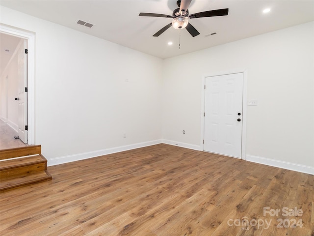 empty room featuring ceiling fan and wood-type flooring