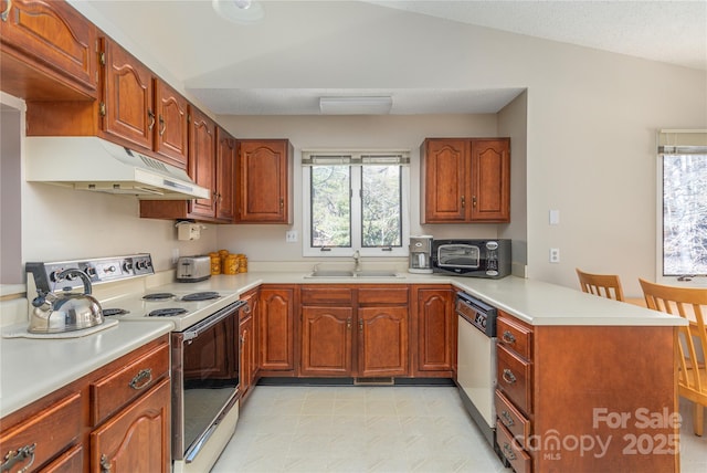 kitchen featuring kitchen peninsula, stainless steel dishwasher, vaulted ceiling, sink, and white range with electric stovetop