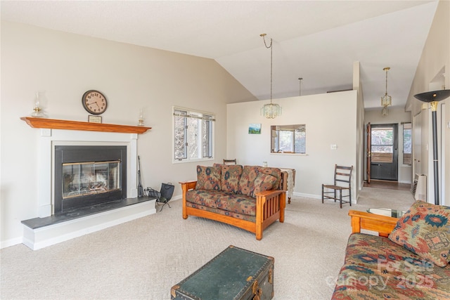 living room with vaulted ceiling and light colored carpet