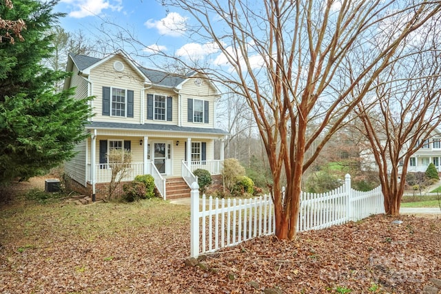 view of front of house with a porch and central AC unit