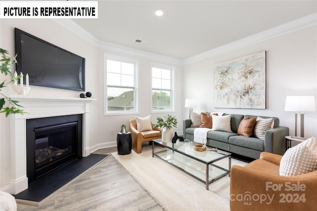 living room with light hardwood / wood-style floors and crown molding