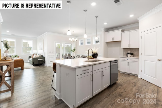 kitchen featuring white cabinetry, stainless steel dishwasher, hanging light fixtures, and an island with sink