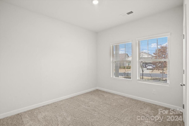 empty room featuring carpet floors