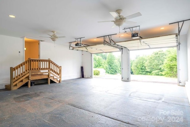 garage featuring ceiling fan and a garage door opener