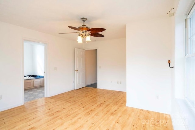 unfurnished room featuring light hardwood / wood-style floors and ceiling fan