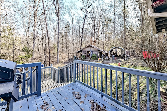 wooden deck featuring an outdoor structure