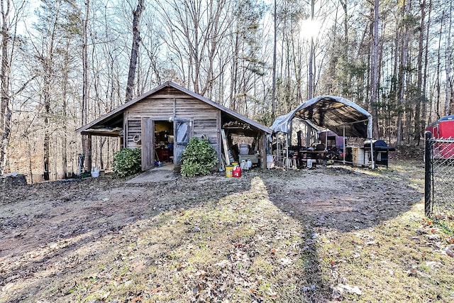 view of front of home featuring an outbuilding