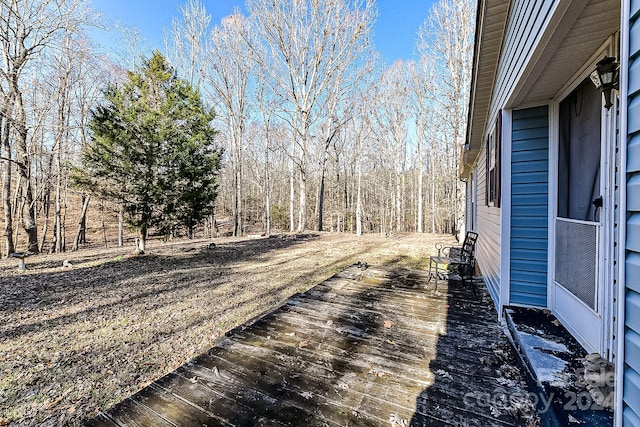 view of yard featuring a wooden deck