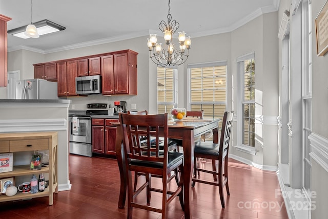 dining space featuring a notable chandelier, dark hardwood / wood-style floors, and ornamental molding